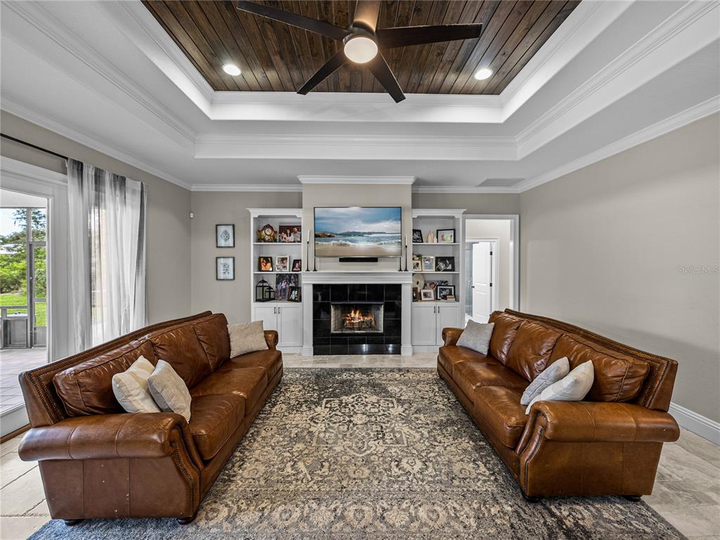 3985 Mammoth Grove Road Lake Wales, FL 33898 - Photo 8 of 97 a living room with furniture and a fireplace