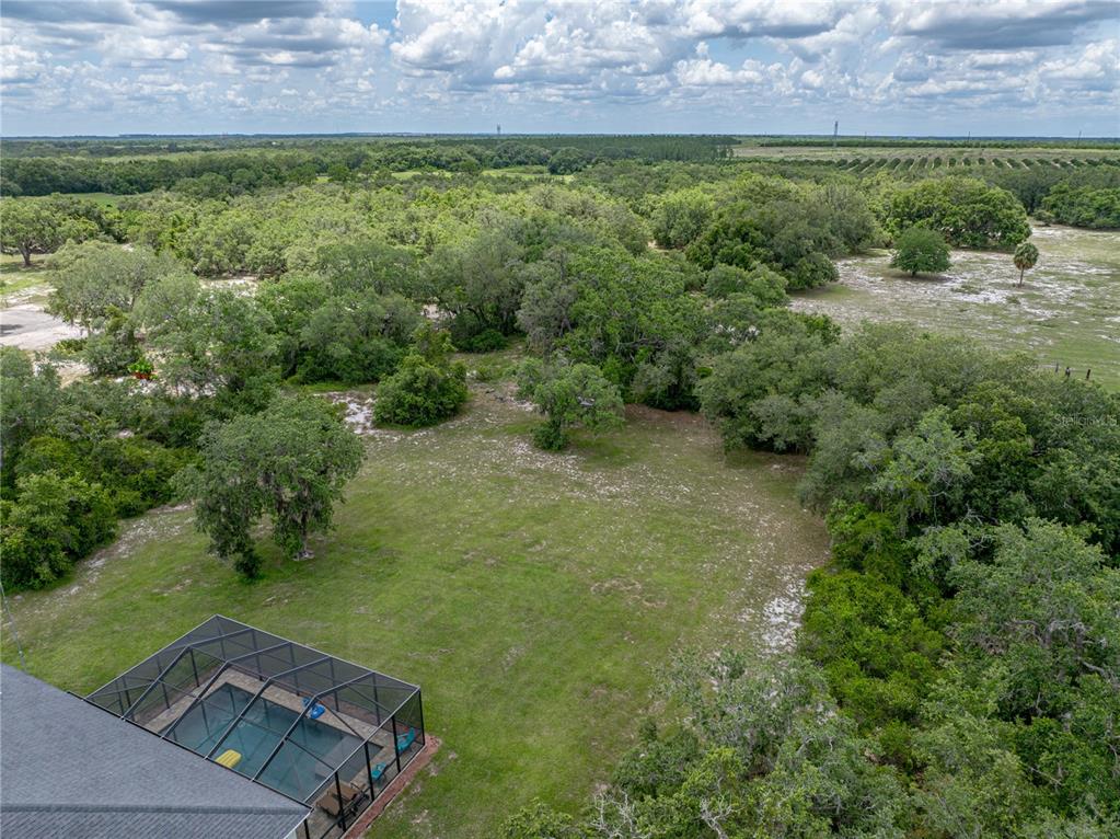3985 Mammoth Grove Road Lake Wales, FL 33898 - Photo 86 of 97 an aerial view of a house with a yard