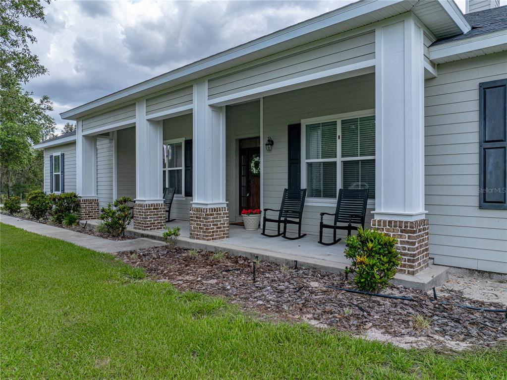 3985 Mammoth Grove Road Lake Wales, FL 33898 - Photo 95 of 97 a view of a house with table and chairs in patio