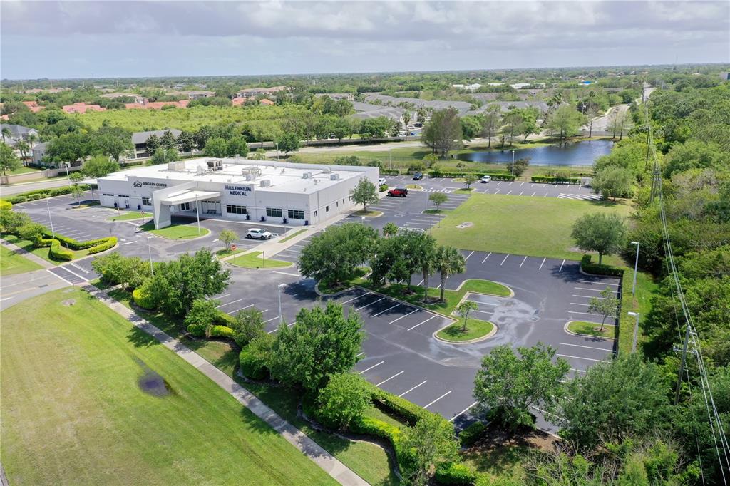 an aerial view of residential houses with outdoor space and river