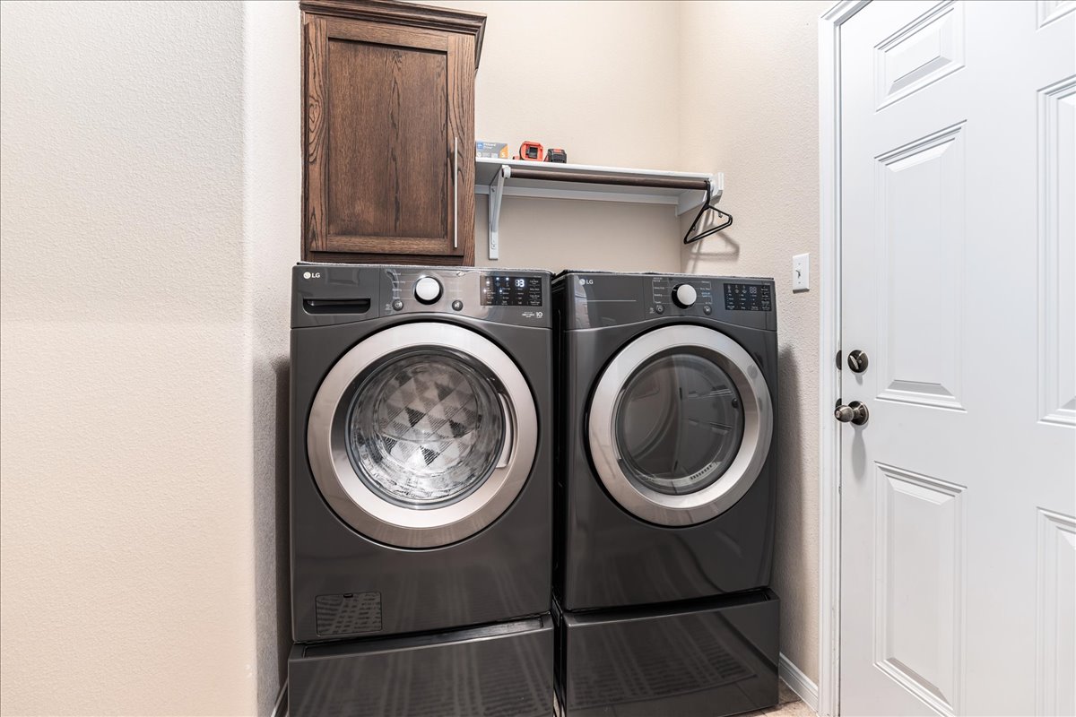 137 Navigator Drive Austin, TX 78717 - Photo 15 of 18 a close up view of a washer and dryer