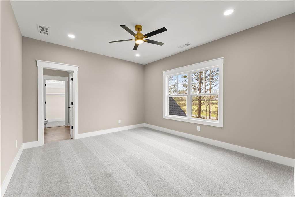 5697 Ball Ground Road Ball Ground, GA 30107 - Photo 17 of 63 an empty room with windows and closet