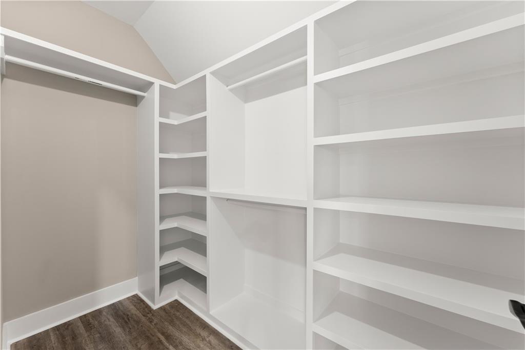 5697 Ball Ground Road Ball Ground, GA 30107 - Photo 25 of 63 a view of walk in closet with empty racks