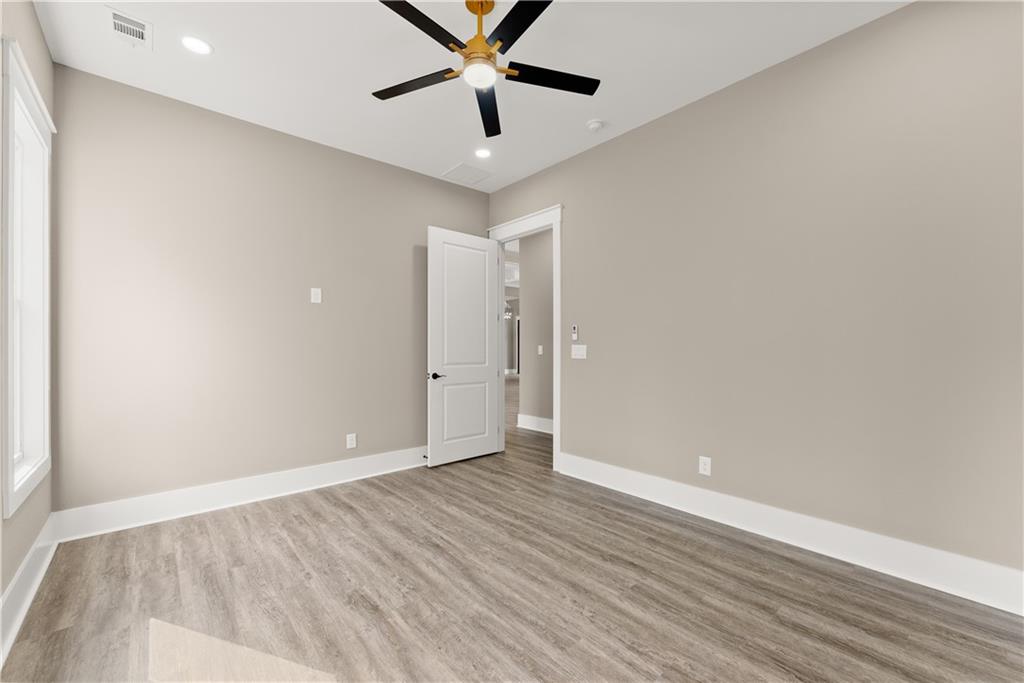 5697 Ball Ground Road Ball Ground, GA 30107 - Photo 35 of 63 wooden floor in an empty room