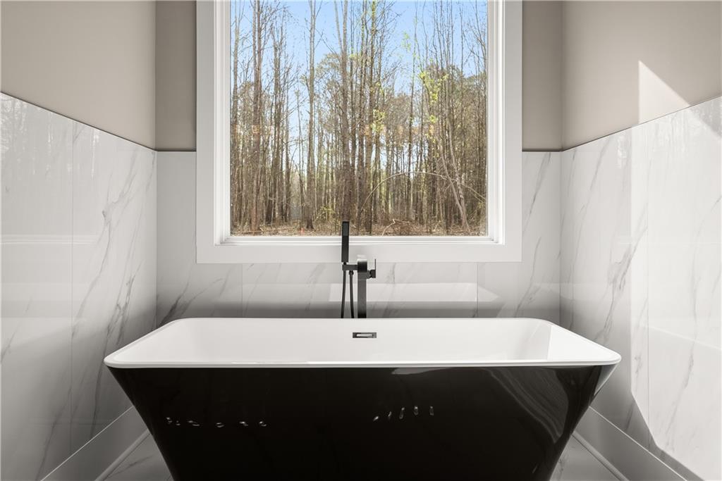 5697 Ball Ground Road Ball Ground, GA 30107 - Photo 41 of 63 a bathroom with a sink and a mirror