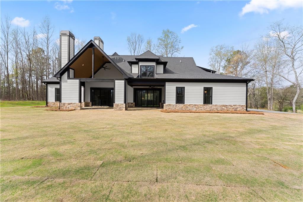 5697 Ball Ground Road Ball Ground, GA 30107 - Photo 54 of 63 a front view of a house with a outdoor space