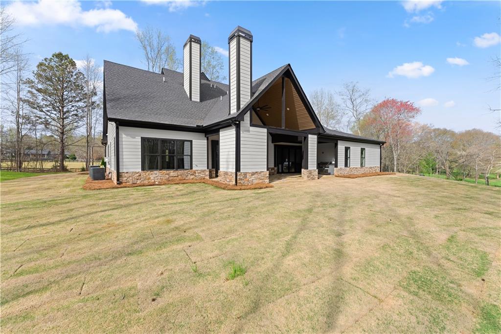 5697 Ball Ground Road Ball Ground, GA 30107 - Photo 55 of 63 a front view of a house with a yard