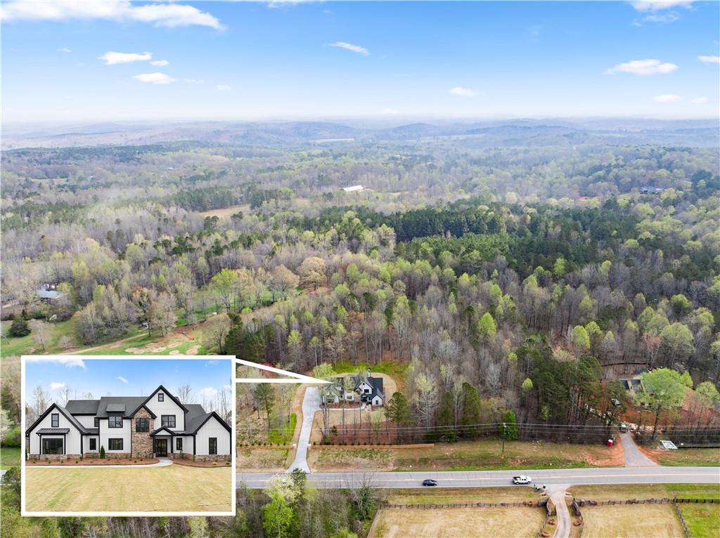 5697 Ball Ground Road Ball Ground, GA 30107 - Photo 57 of 63 an aerial view of a house with a yard and lake view
