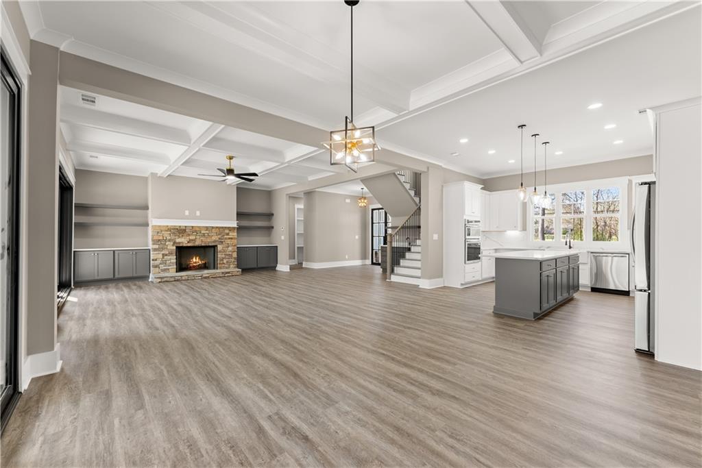 5697 Ball Ground Road Ball Ground, GA 30107 - Photo 9 of 63 a view of a kitchen with a sink a refrigerator and a stove top oven