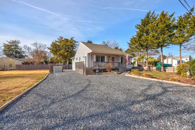 a view of a house with a yard covered with snow