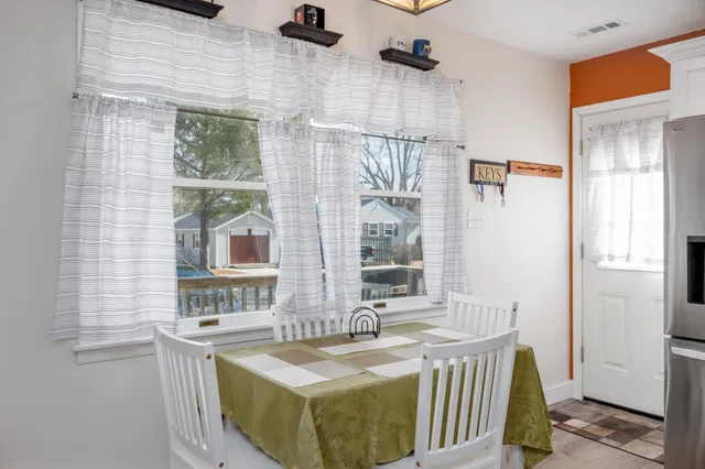 a dining room with a sink and a window