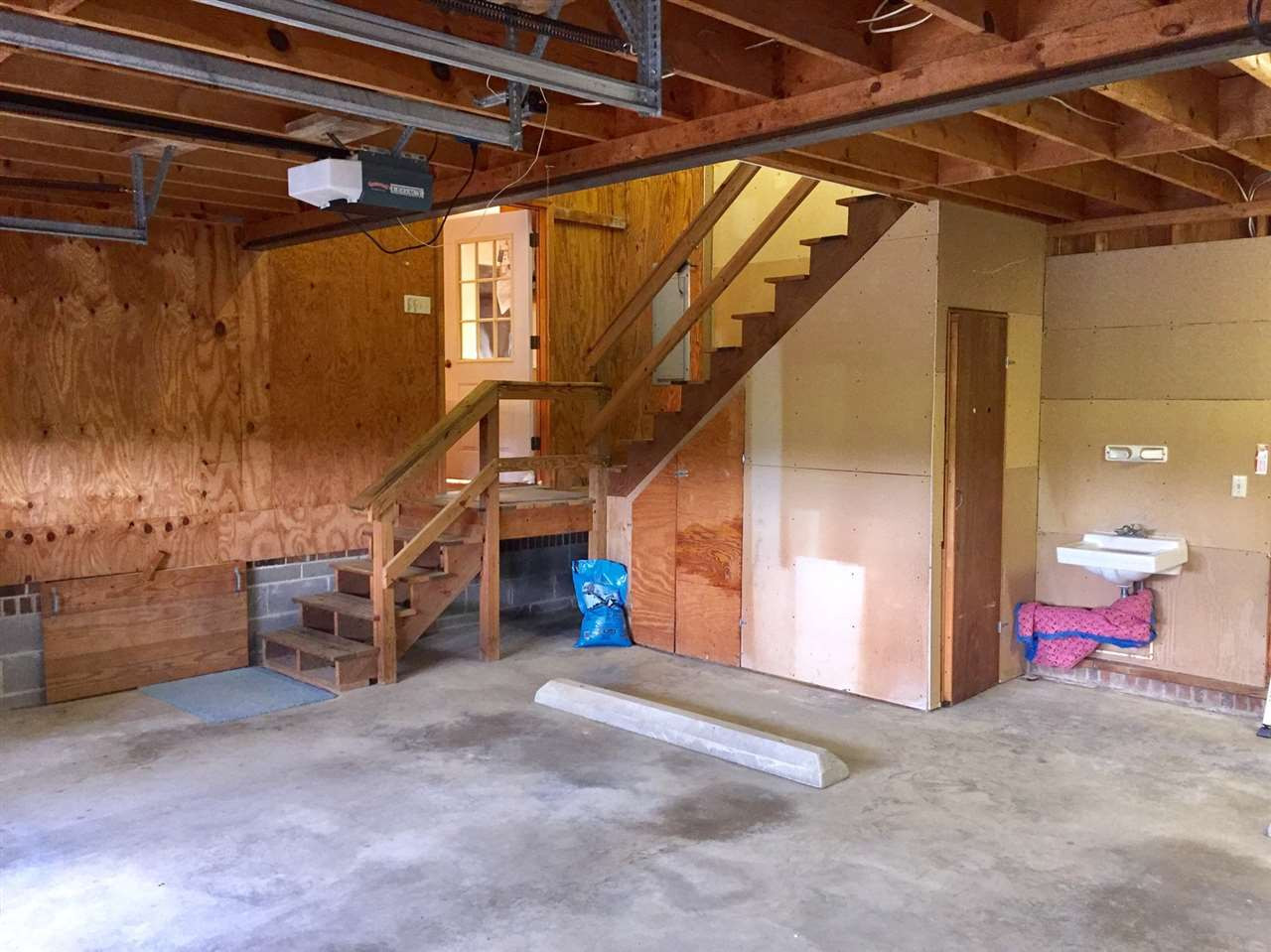 2693 Benson Hardee Road Benson, NC 27504 - Photo 8 of 25 Attached garage with permanent stairs to upstairs storage. Garage