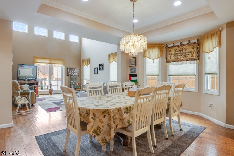 36 Harrison Street Nutley, NJ 07110 - Photo 12 of 36 a view of a dining room with furniture wooden floor and chandelier