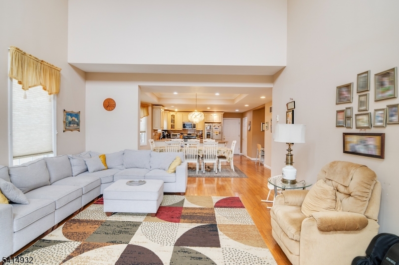 36 Harrison Street Nutley, NJ 07110 - Photo 19 of 36 a living room with furniture and a large mirror