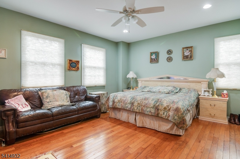 36 Harrison Street Nutley, NJ 07110 - Photo 20 of 36 a bedroom with a large bed and a couch