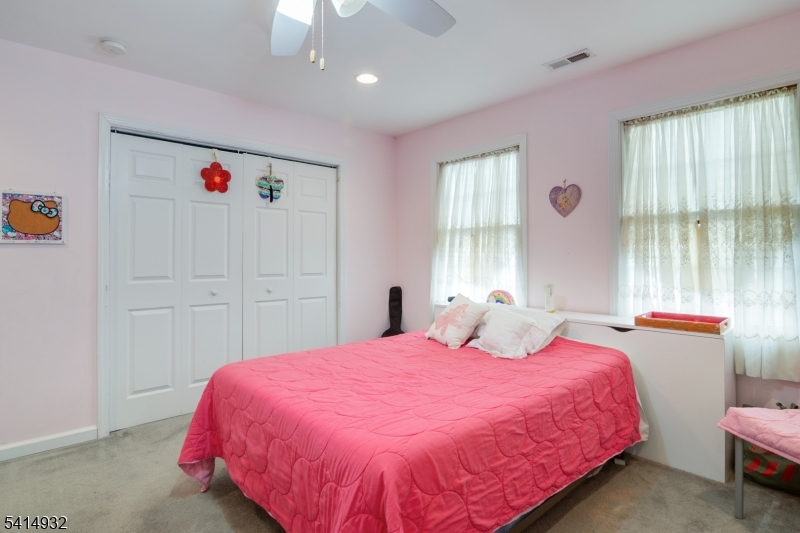 36 Harrison Street Nutley, NJ 07110 - Photo 22 of 36 a bedroom with a bed and window
