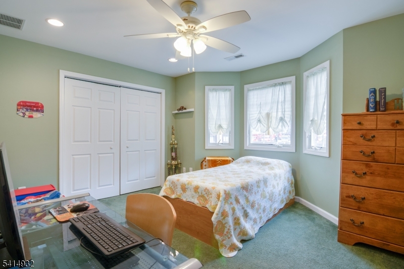 36 Harrison Street Nutley, NJ 07110 - Photo 29 of 36 a bedroom with a bed and a window