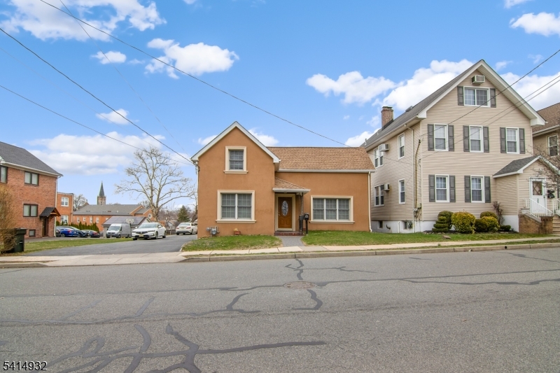 36 Harrison Street Nutley, NJ 07110 - Photo 9 of 36 a front view of a house with a yard