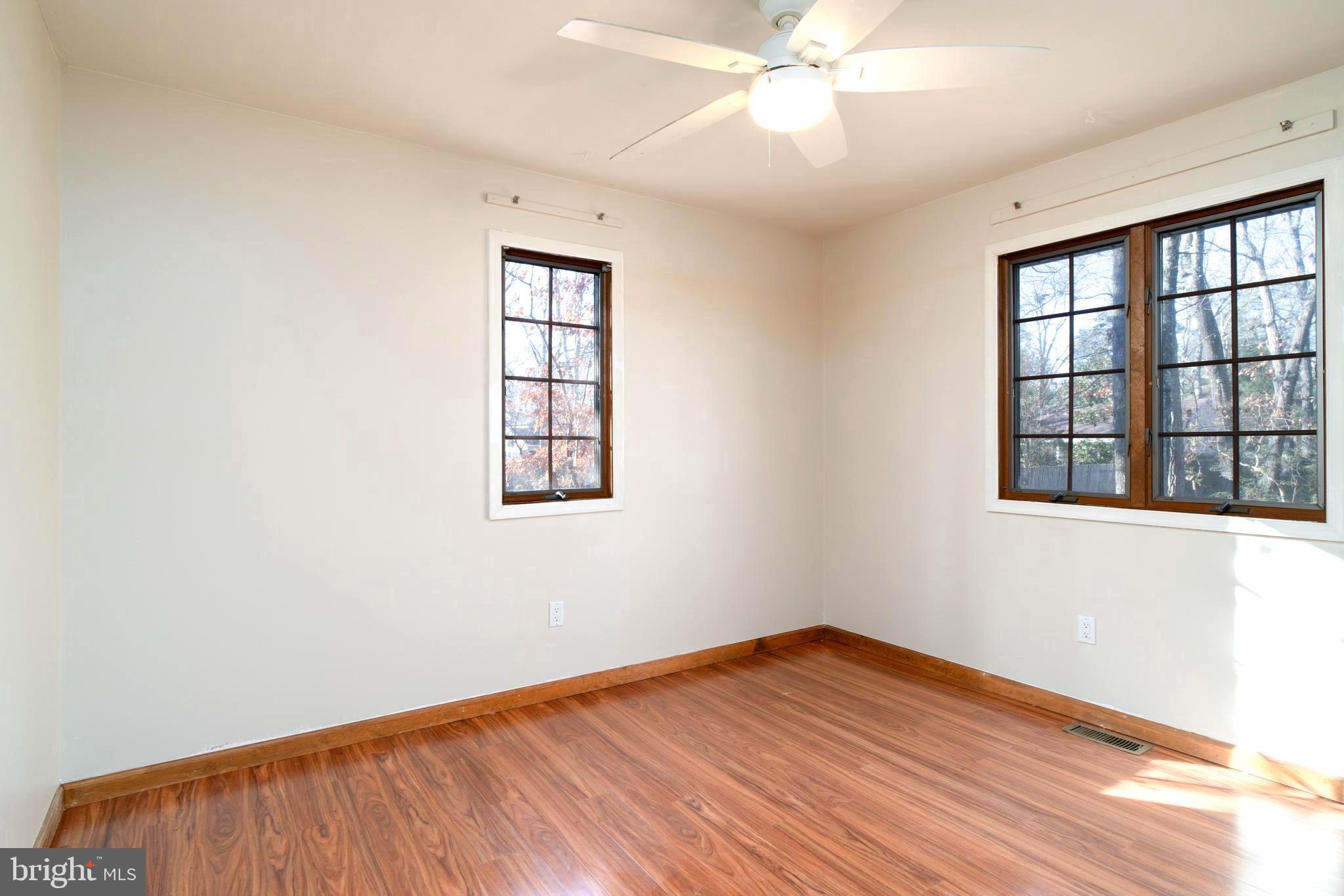 38 Summit Drive Tabernacle, NJ 08088 - Photo 17 of 42 an empty room with wooden floor fan and windows