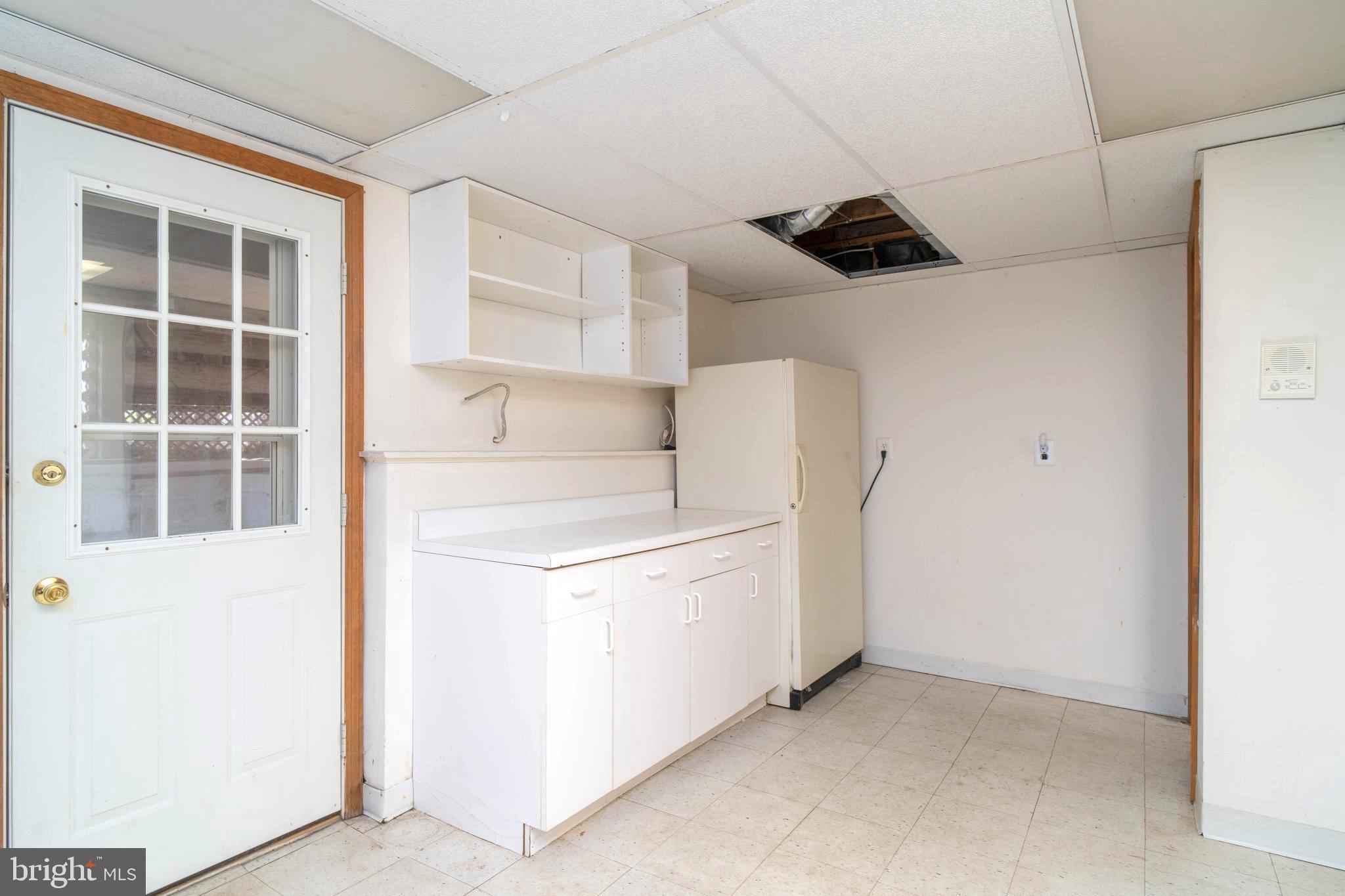 38 Summit Drive Tabernacle, NJ 08088 - Photo 32 of 42 a kitchen with a refrigerator and cabinets