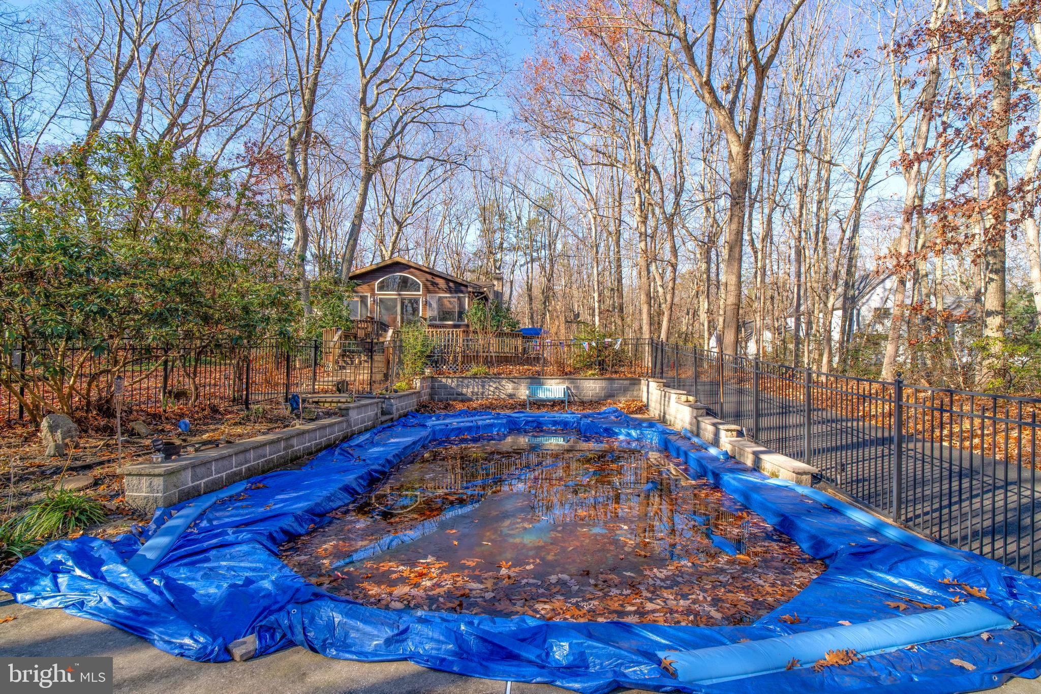 38 Summit Drive Tabernacle, NJ 08088 - Photo 37 of 42 a view of a swimming pool with an outdoor space and seating area