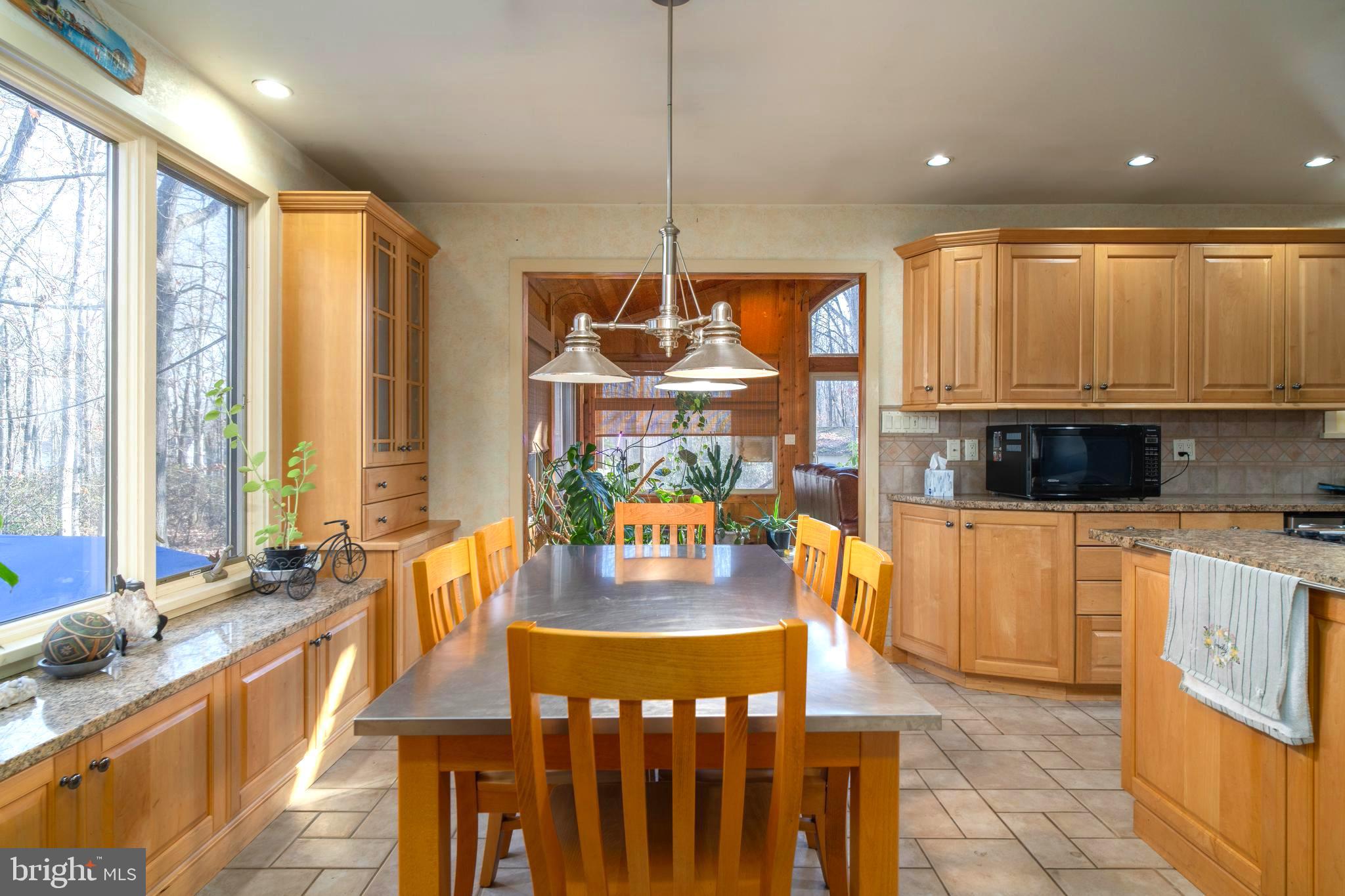 38 Summit Drive Tabernacle, NJ 08088 - Photo 5 of 42 a view of a kitchen with kitchen island granite countertop a large window and a dining table