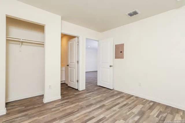a view of a livingroom with wooden floor