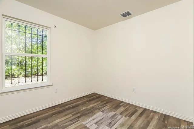 a view of a room that has a window in it