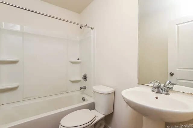 a bathroom with a sink toilet and bathtub