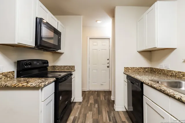 a kitchen with a stove and a microwave