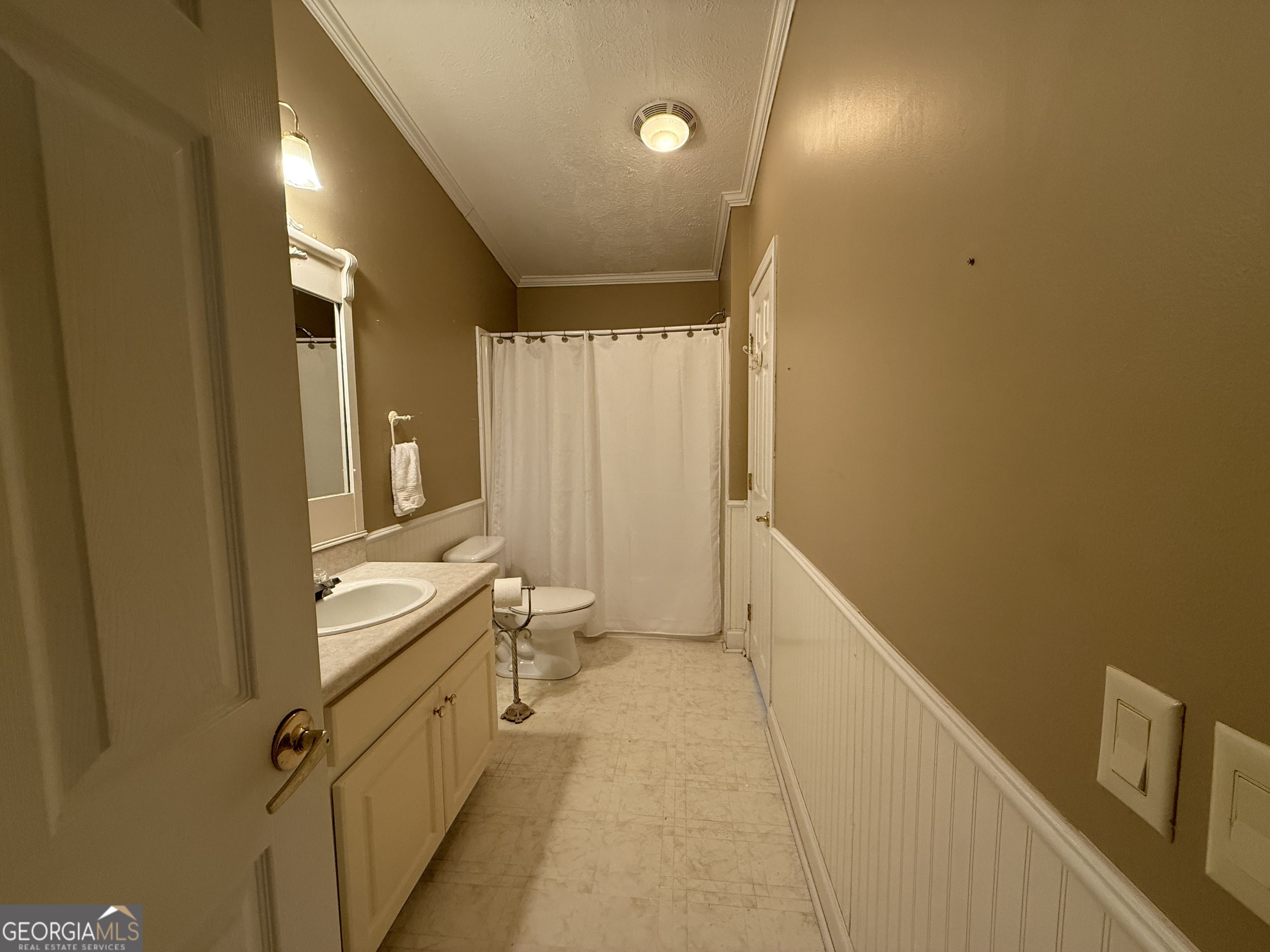 1081 Marshall Church Road Thomson, GA 30824 - Photo 12 of 26 a bathroom with a sink a toilet and shower