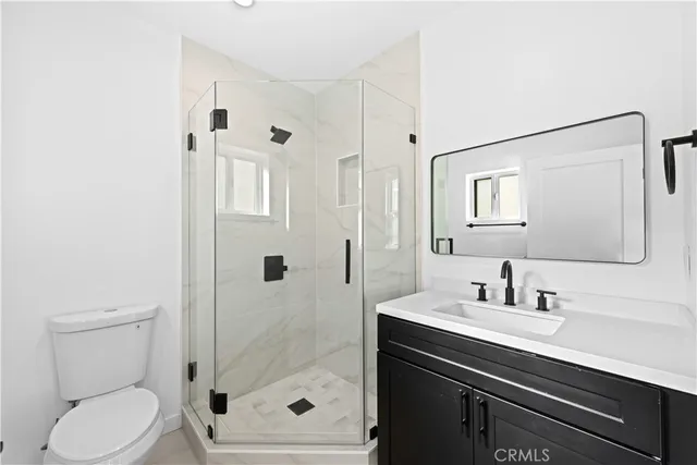 a close view of a utility room with dryer and washer