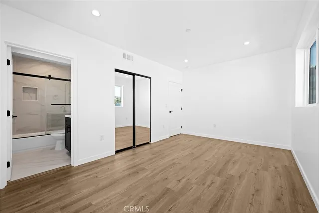 a bathroom with a sink toilet a mirror and shower