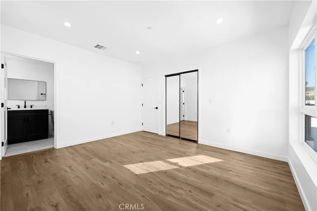 a bathroom with a sink mirror toilet and shower