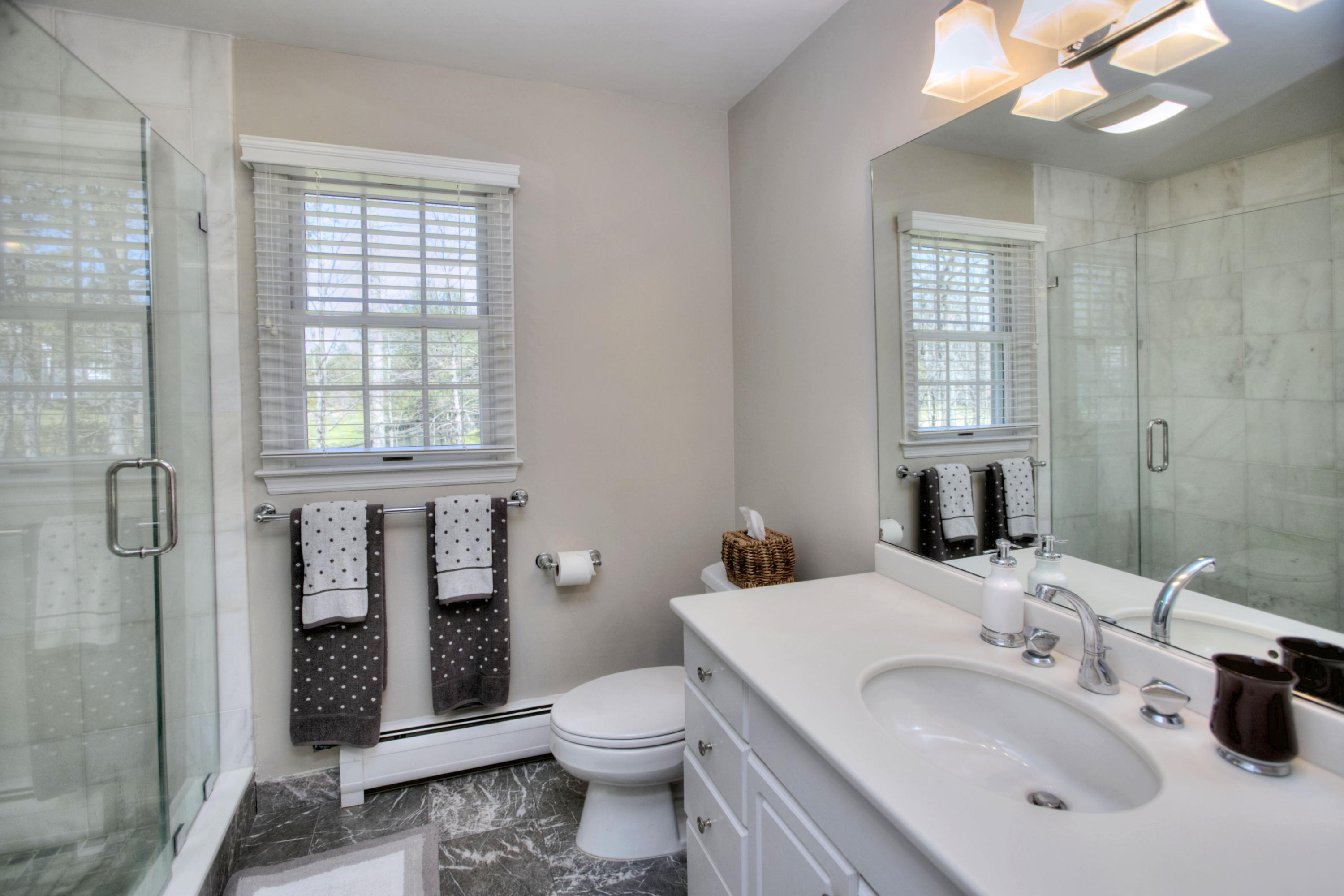 27 Summit Ridge Road New Canaan, CT 06840 - Photo 14 of 25 a bathroom with a sink toilet and shower