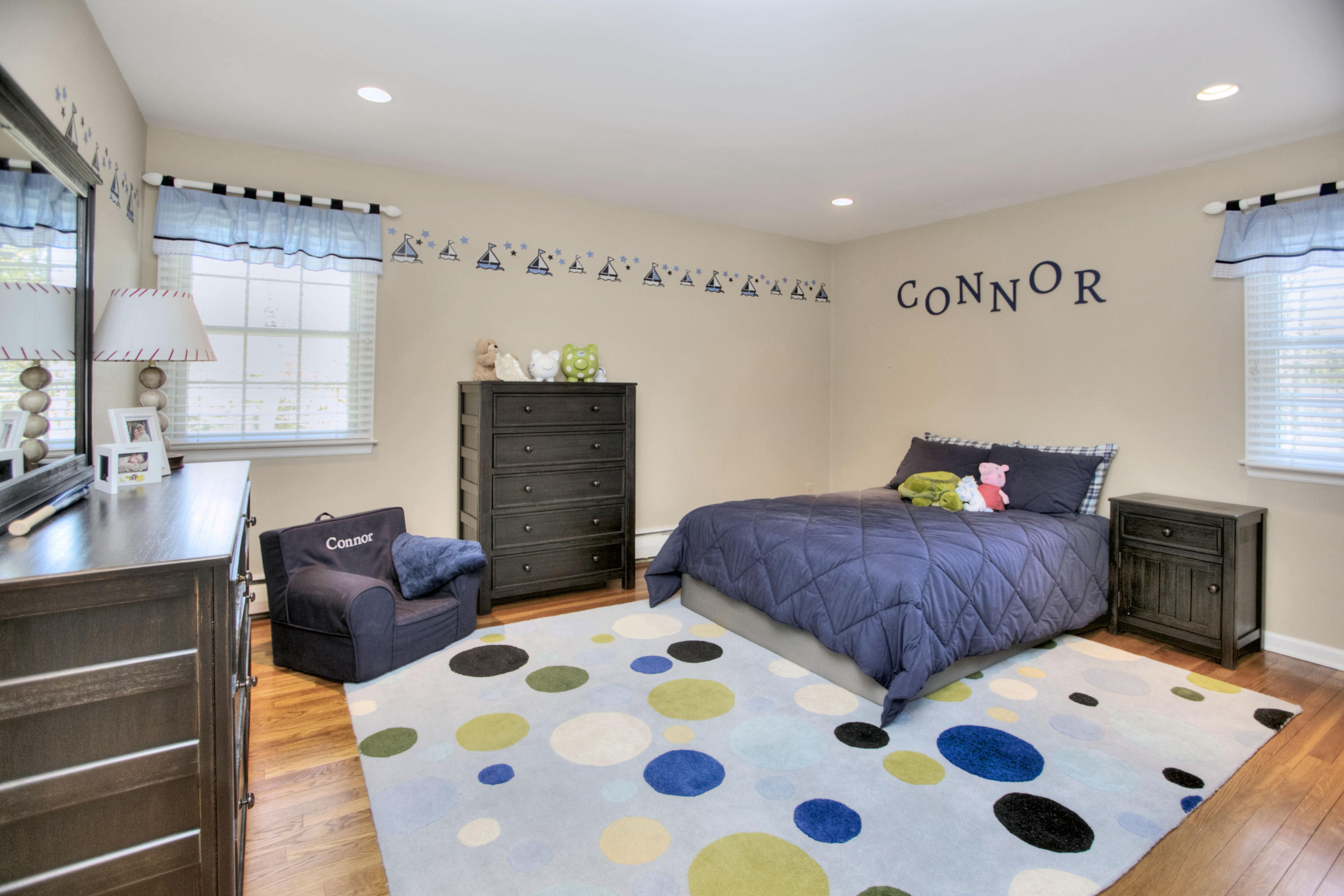 27 Summit Ridge Road New Canaan, CT 06840 - Photo 15 of 25 a bedroom with a bed and a dresser