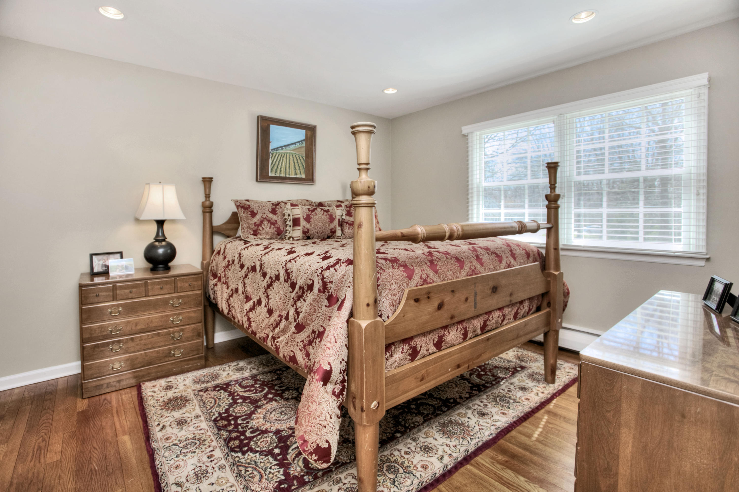 27 Summit Ridge Road New Canaan, CT 06840 - Photo 17 of 25 a bedroom with a bed and a window