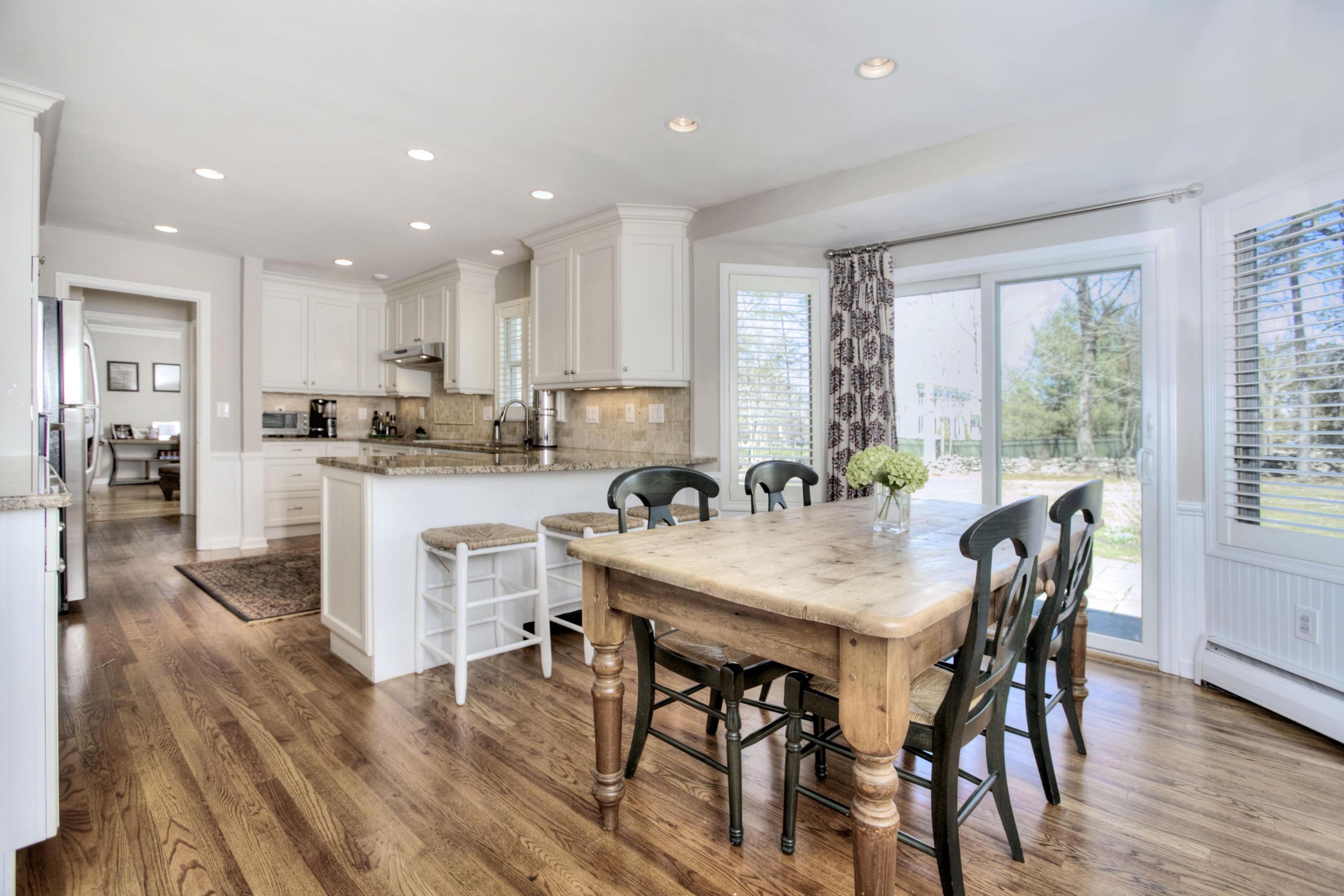 27 Summit Ridge Road New Canaan, CT 06840 - Photo 5 of 25 a view of a dining room with furniture and wooden floor