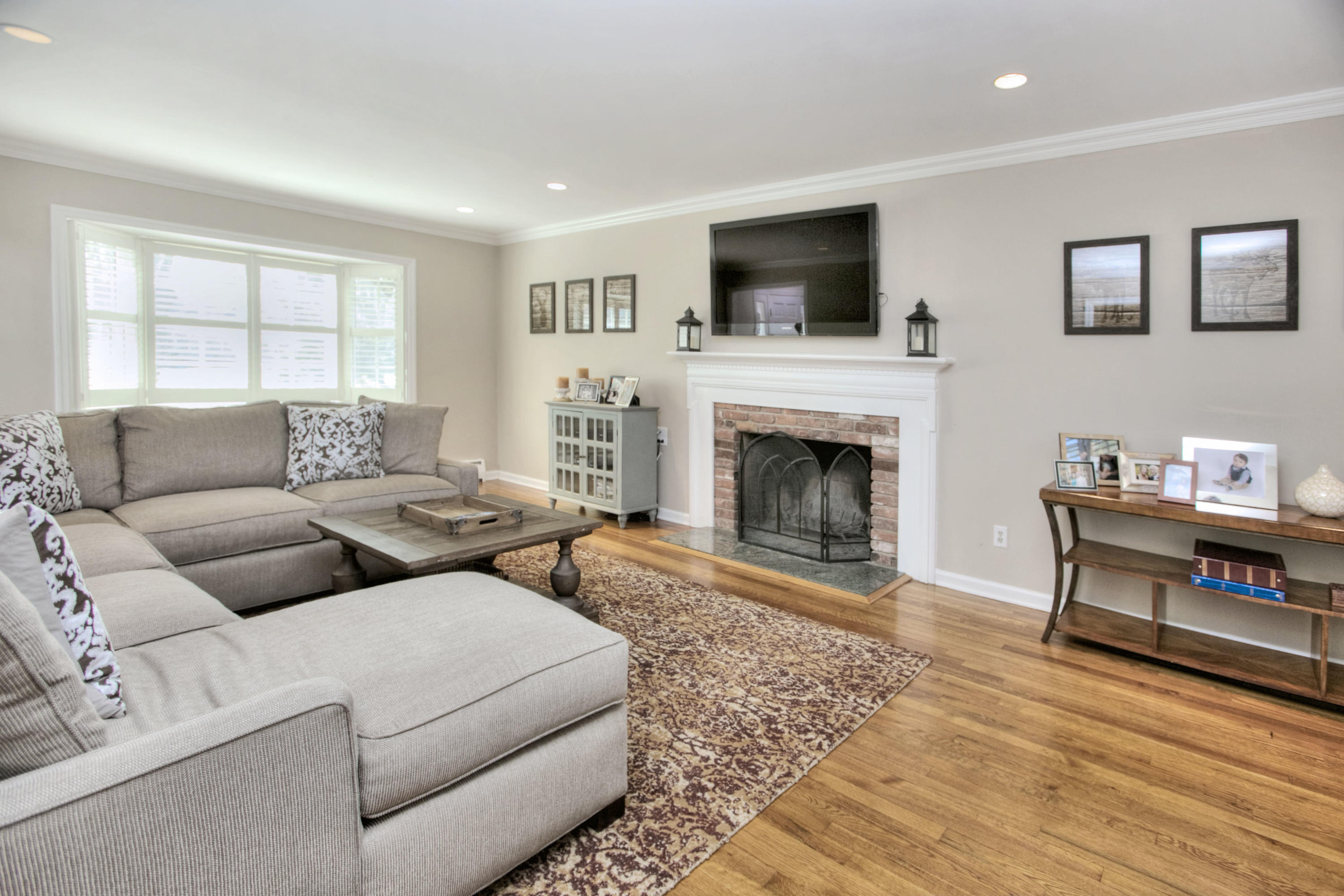 27 Summit Ridge Road New Canaan, CT 06840 - Photo 7 of 25 a living room with furniture and a fireplace