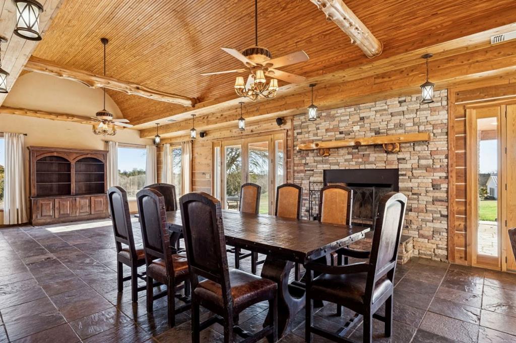 1922 A Bethel-Cannon Road Whitewright, TX 75491 - Photo 10 of 40 Spacious room featuring wood-paneled ceiling, exposed wood beams, and textured floor tiles