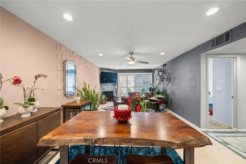 a living room filled with furniture and a potted plant