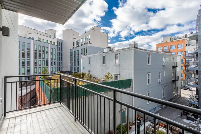 a view of a balcony with wooden floor