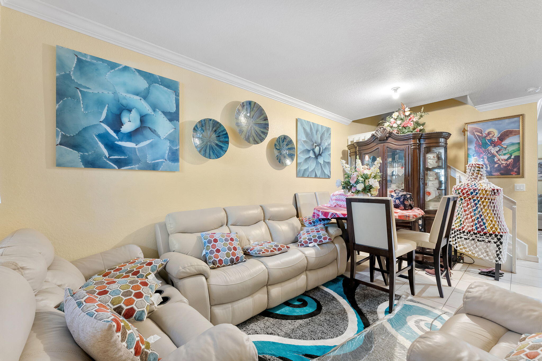 5438 Northwest 27th Street Margate, FL 33063 - Photo 22 of 50 a living room with furniture and painting on the wall