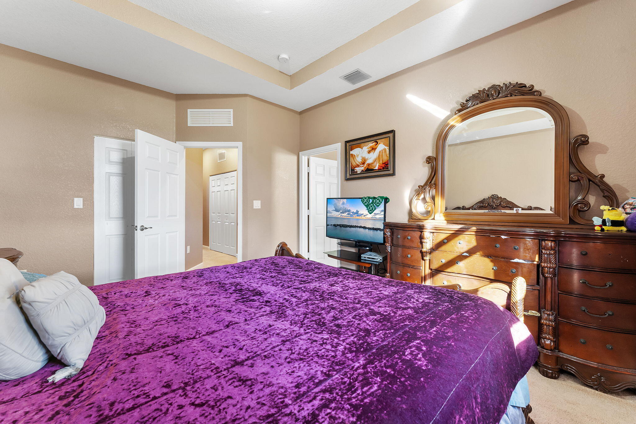 5438 Northwest 27th Street Margate, FL 33063 - Photo 26 of 50 a bedroom with a bed and a dresser