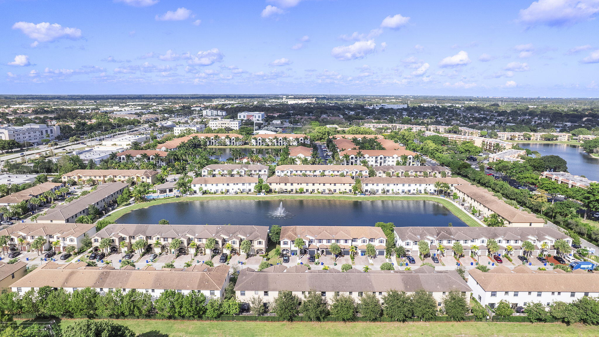 5438 Northwest 27th Street Margate, FL 33063 - Photo 3 of 50 an aerial view of a city with lots of residential buildings ocean and mountain view in back