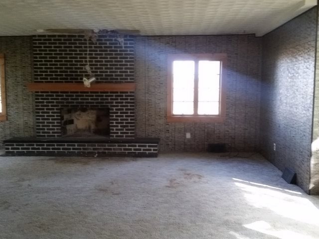 7172 Daysville Road Oregon, IL 61061 - Photo 8 of 13 a view of an empty room with a fireplace
