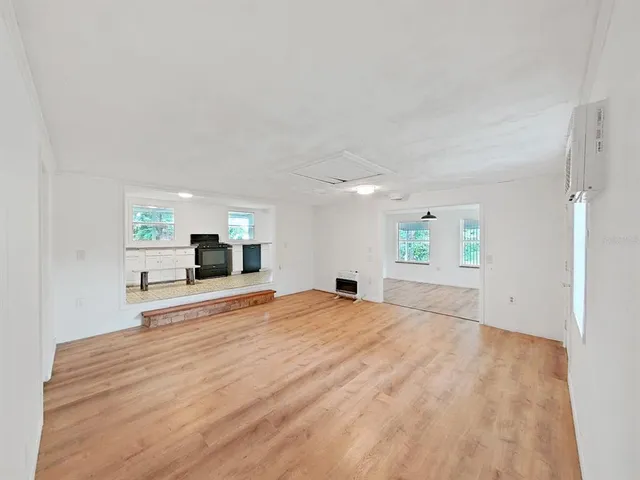 a room with a bed and furniture