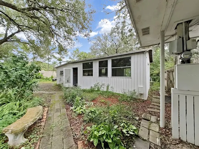a backyard of a house with lots of green space