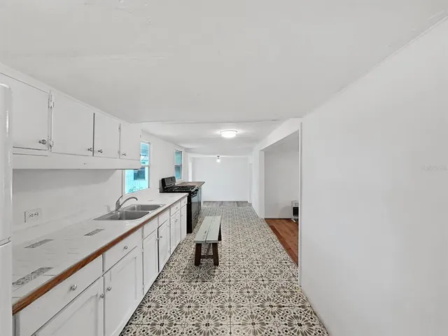 a kitchen with a sink and cabinets