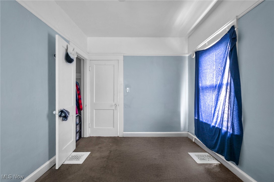 738 Eddy Road Cleveland, OH 44108 - Photo 25 of 33 Carpeted spare room with baseboards